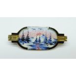 A Scandinavian silver gilt enamel winter scene brooch, marked Norne 925S, 32mm