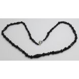 A faceted jet bead necklace, 62cm
