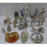 A large collection of English and continental figures, cherub wall pocket, wax candle figure,