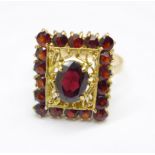 A 9ct gold and garnet ring, 4.3g, S