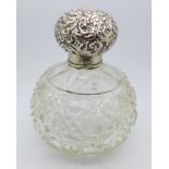 A silver topped cut glass perfume bottle, Birmingham 1903, silver rim a/f