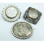 Three c.1900 white metal brooches