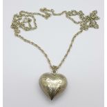 A .925 silver heart pendant on a silver chain