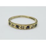 A 9ct gold, seven stone sapphire and diamond ring, 1.0g, M