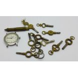 Pocket watch keys and a quartz Longines wristwatch, 24mm case