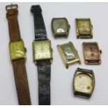 Seven tank shaped wristwatches and cases including Bulova
