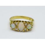 An 18ct gold, opal and diamond ring, 3.5g, L