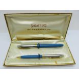 A Sheaffer 'new Snorkel pen' pen and pencil set, with 14k nib, cased with original guarantee/