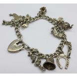 A silver charm bracelet, charms include Mickey Mouse, Minnie Mouse and Donald Duck, 46.1g