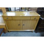 A walnut sideboard and matching extending dining table