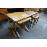 A Legate teak nest of tables and a Nathan teak nest of two tables