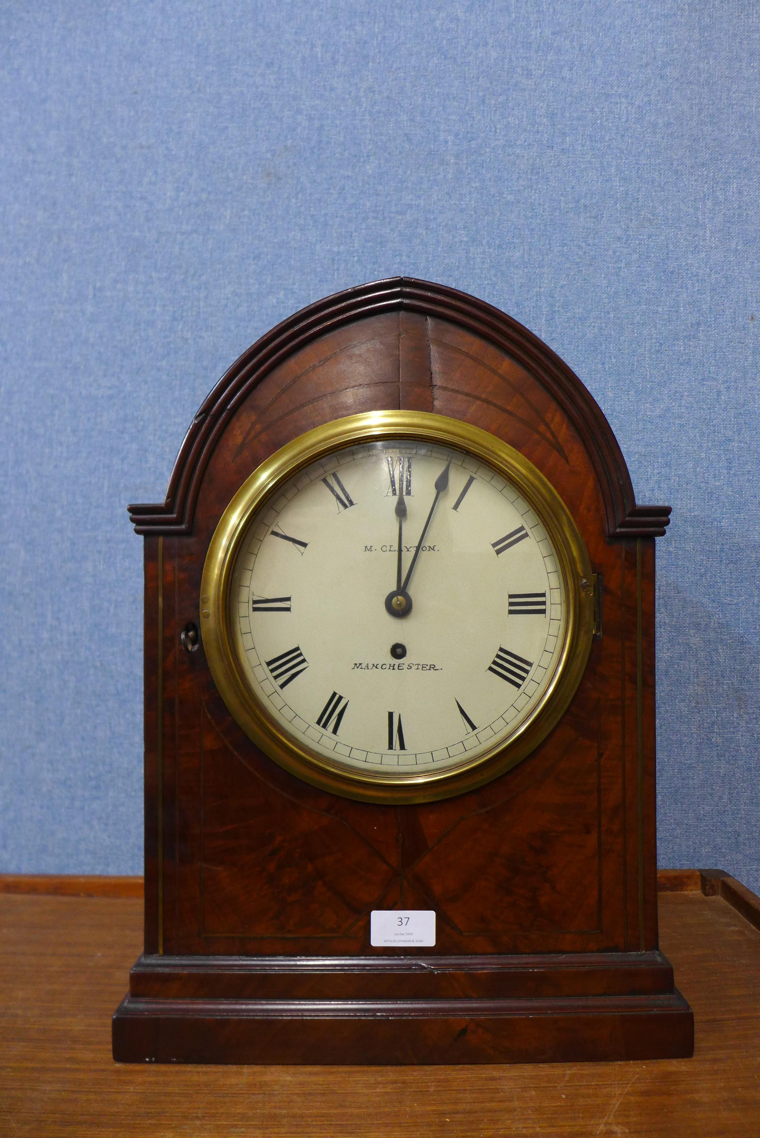 A George IV mahogany lancet shaped bracket clock, the painted dial signed M. Clayton, Manchester,