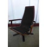 A Scandinavian teak swivel lounge chair