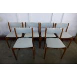 A set of six teak dining chairs