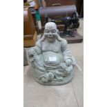 A concrete Buddha garden ornament