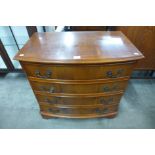 A yew wood bow front chest of drawers