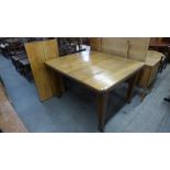 A Victorian oak extending dining table, 74cms h, 106cms w, 123cms l (176 cms l extended)