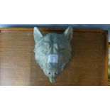 A concrete wolf's head