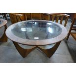 A G-Plan Astro teak and glass topped circular coffee table