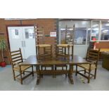 A Nigel Griffiths oak refectory table and six chairs (table dimensions; 74cms h, 90cms w, 182cms l