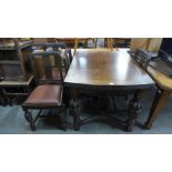 A carved oak draw-leaf table and four chairs