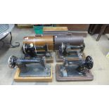 Two cased Singer sewing machines and two others