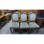 A set of six Victorian carved oak and upholstered dining chairs