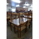 A Danish teak draw-leaf dining table and six chairs