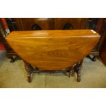 A Victorian walnut Sutherland table, 71cms h x 88cms l