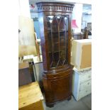 A burr walnut freestanding corner cabinet