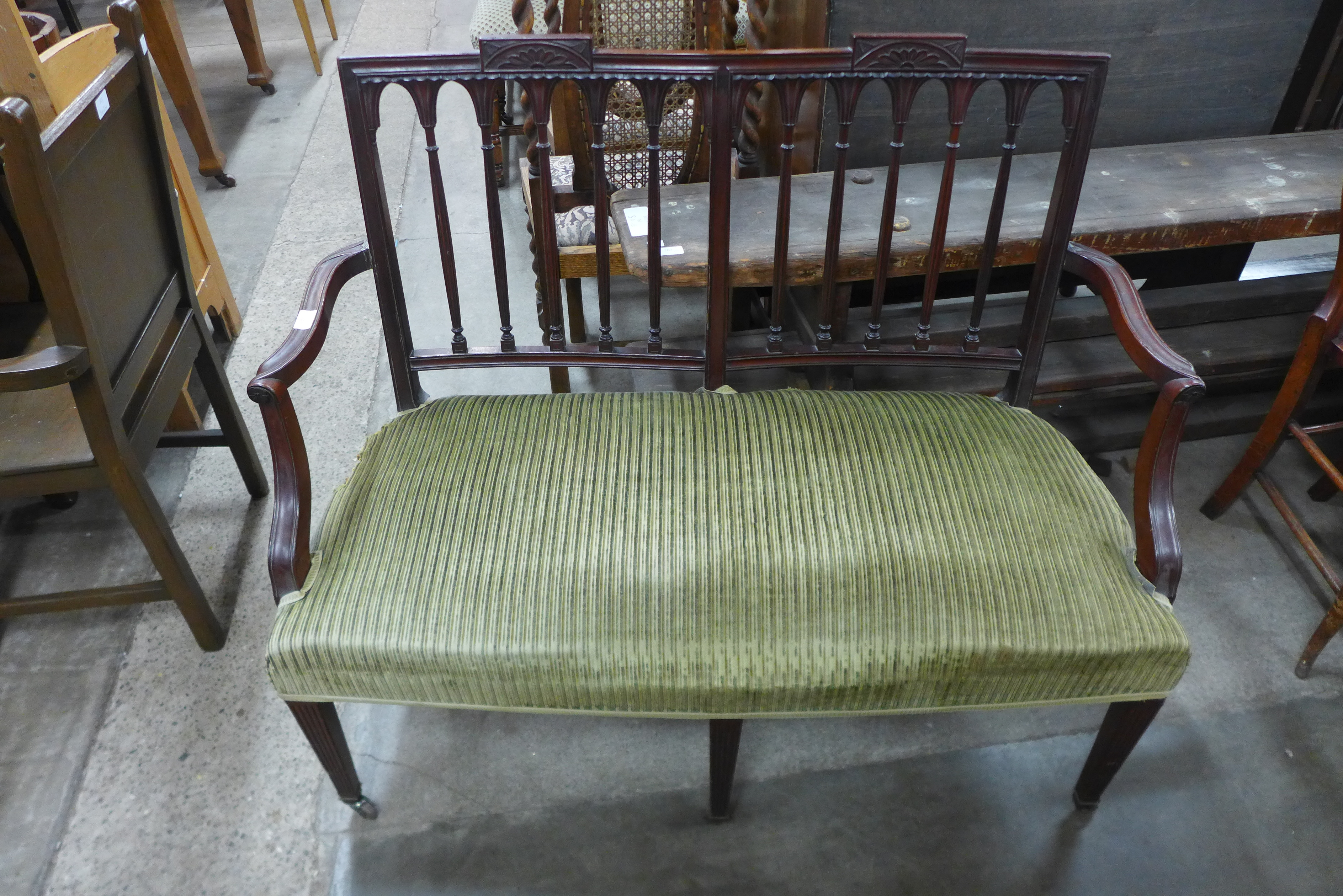 An Edward VII mahogany and upholstered salon settee