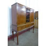 A mahogany three door bookcase