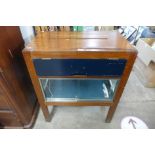 A teak slot display cabinet and four teak dining chairs