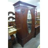 An Arts and Crafts mahogany wardrobe