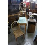 Two elm and beech kitchen chairs, an oak pot cupboard and a drop-leaf kitchen table