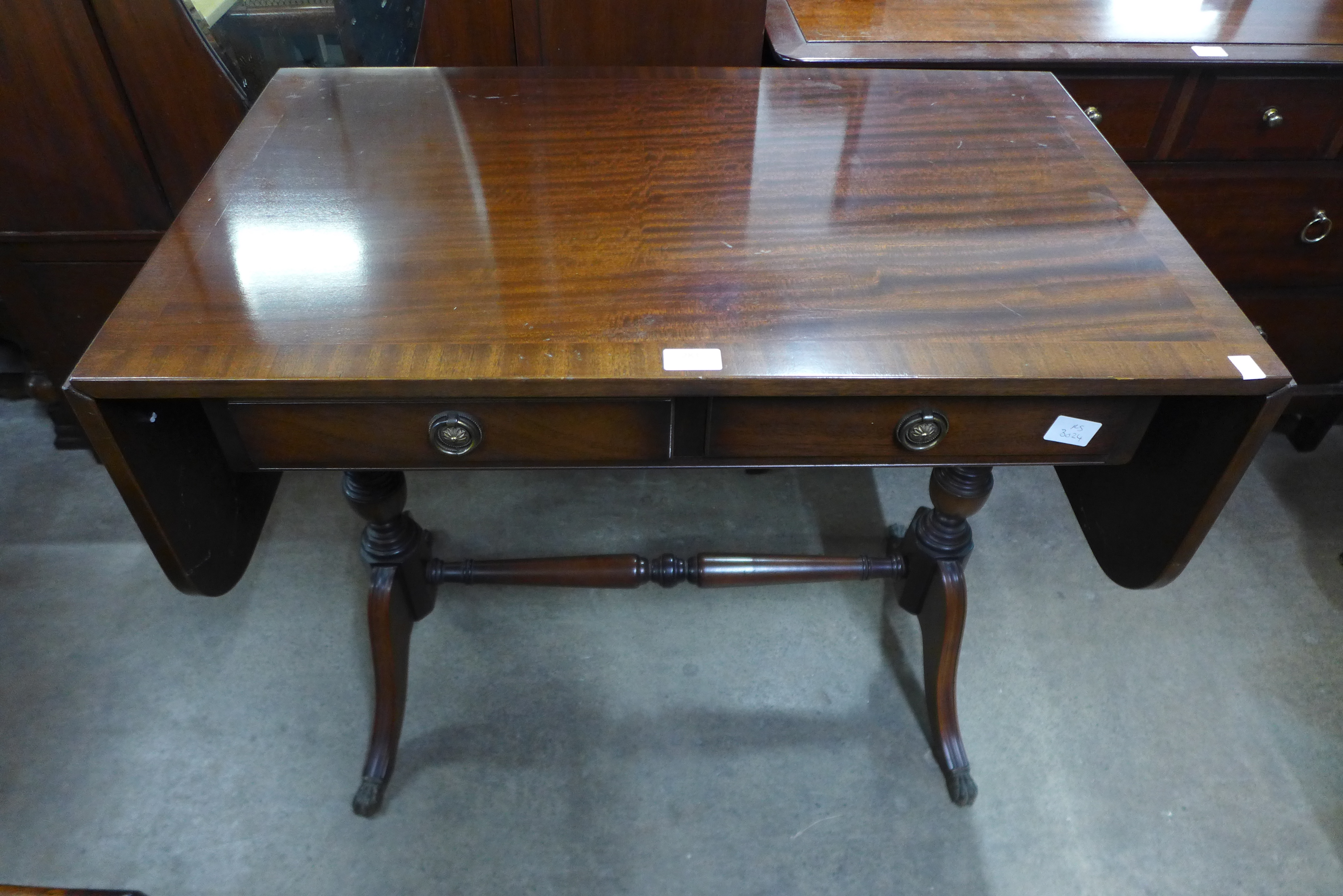 A set of three oak dining chairs and a mahogany drop-leaf sofa table