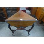 An Edward VII mahogany drop leaf triangular occasional table, 73cms h