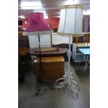 A Victorian wrought iron and copper telescopic standard lamp and a painted standard lamp