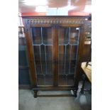 An oak two door display cabinet