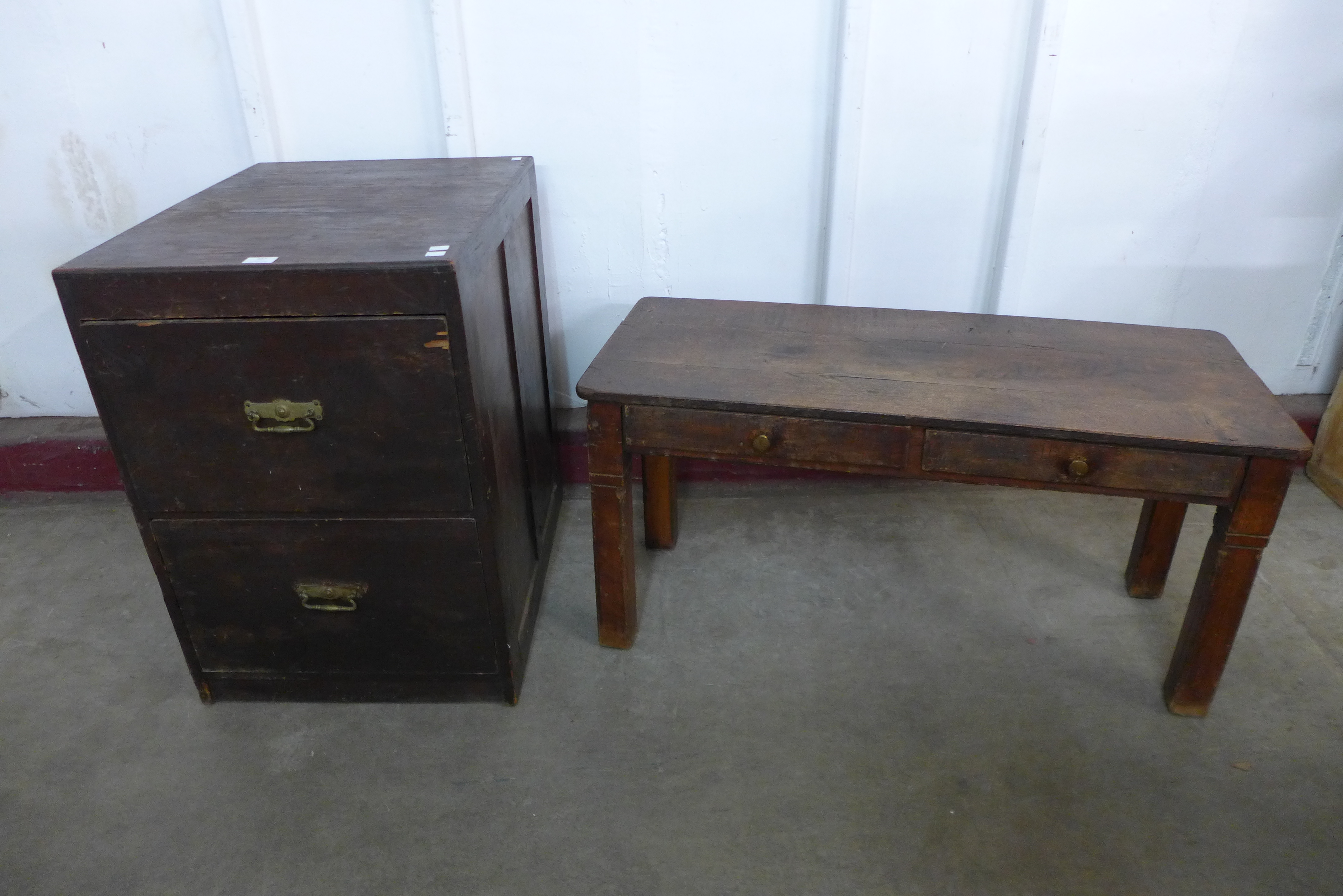 An oak two drawer filing cabinet and a small French table