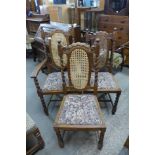 A set of three oak barleytwist bergere dining chairs