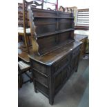 An Ercol Old Colonial dark elm dresser