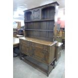 An oak early 20th Century barleytwist dresser, 195cms h, 137cms w, 47cms d