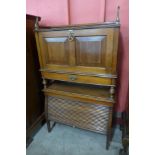 A Victorian Writing Cabinet Patent mahogany tambour front writing cabinet, manner of Jas Schoolbred,