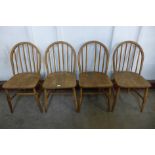 A set of four Ercol Blonde Windsor elm and beech chairs, a/f