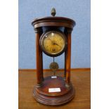 A 19th Century German walnut temple clock, 32cms h