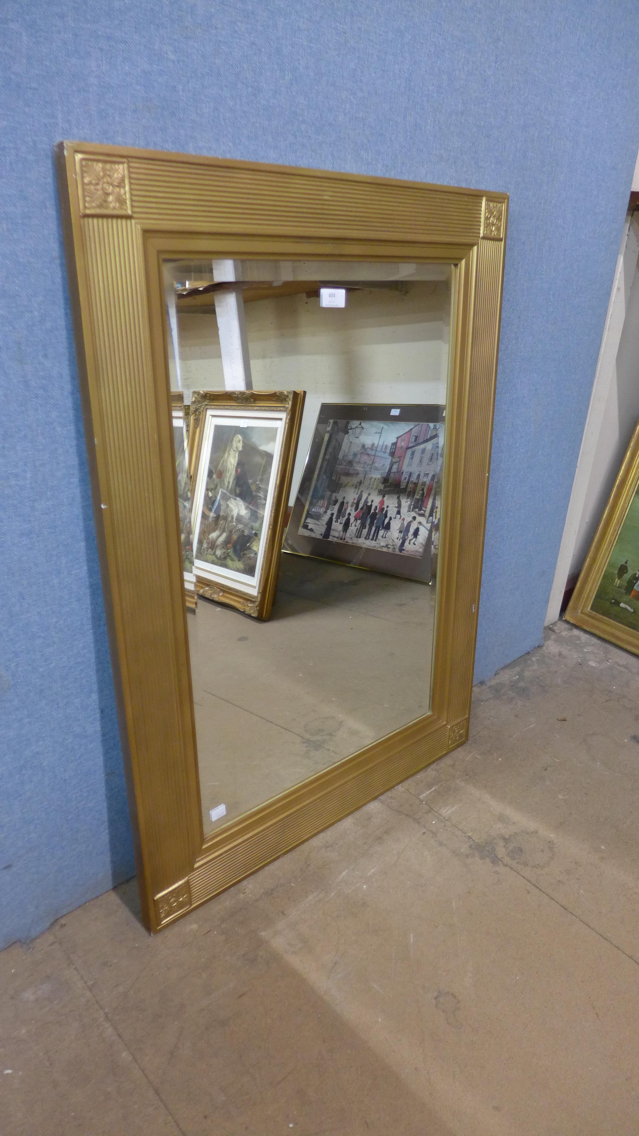 A gilt framed mirror