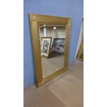 A gilt framed mirror