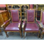 A pair of similar Victorian carved oak and upholstered armchairs, 134cms h, 72cms w70cms d