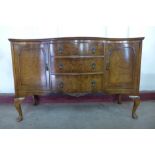 A walnut serpentine sideboard